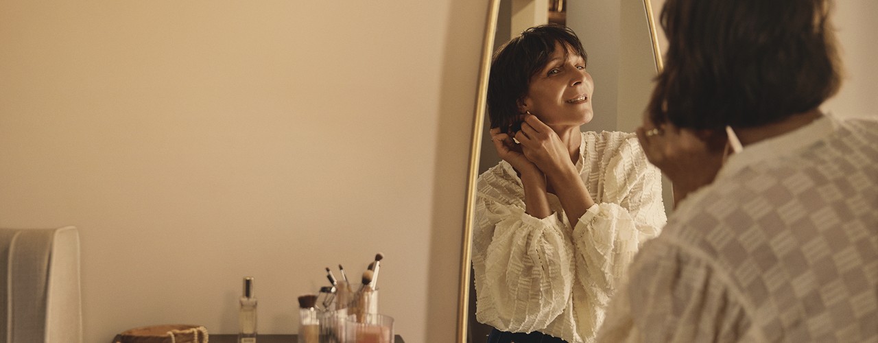 Woman looking in mirror
